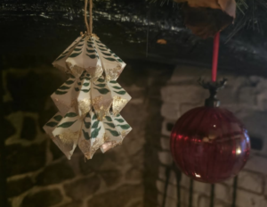 Handmade Christmas decoration from a fellow stall holder hanging among our Christmas decorations in a cosy Dorset cottage.