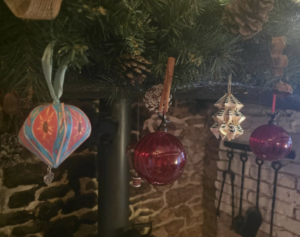 Handmade Christmas decoration from a fellow stall holder hanging among our Christmas decorations in a cosy Dorset cottage