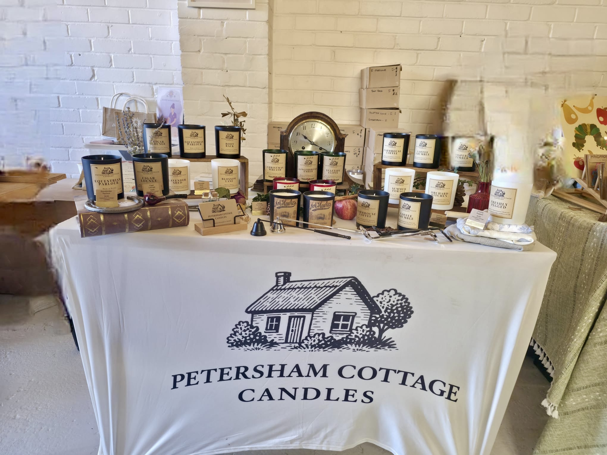 Petersham Cottage Candles stall at Pearhaus Coffee Christmas Market with hand-poured candles and festive display.
