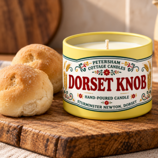 Dorset Knob scented candle in yellow tin with Dorset Knob bread rolls