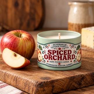 Spiced Orchard scented candle in green tin with fresh apple