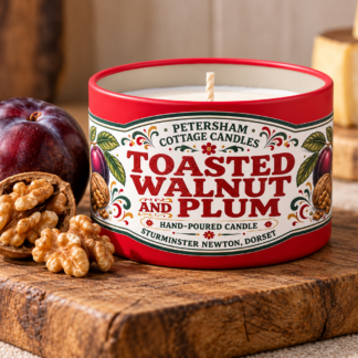 Toasted Walnut & Plum scented candle in red tin with plums and walnuts